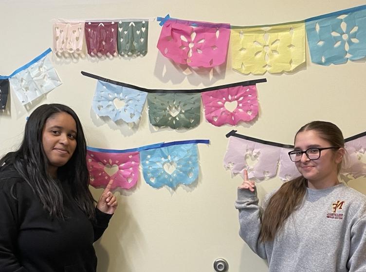 Two HFU Spanish students posing with the classes work